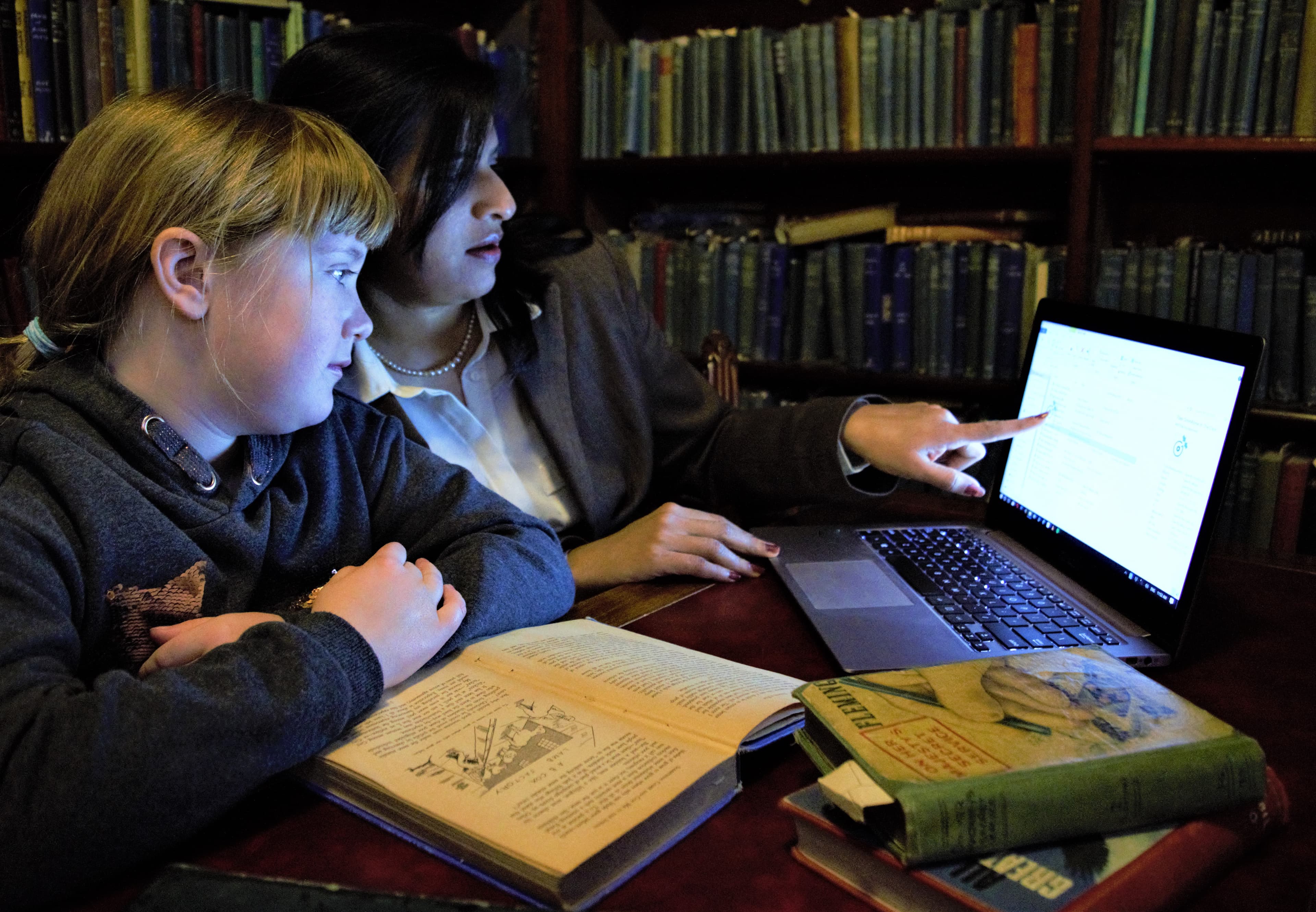 One-on-one tutoring session with laptop