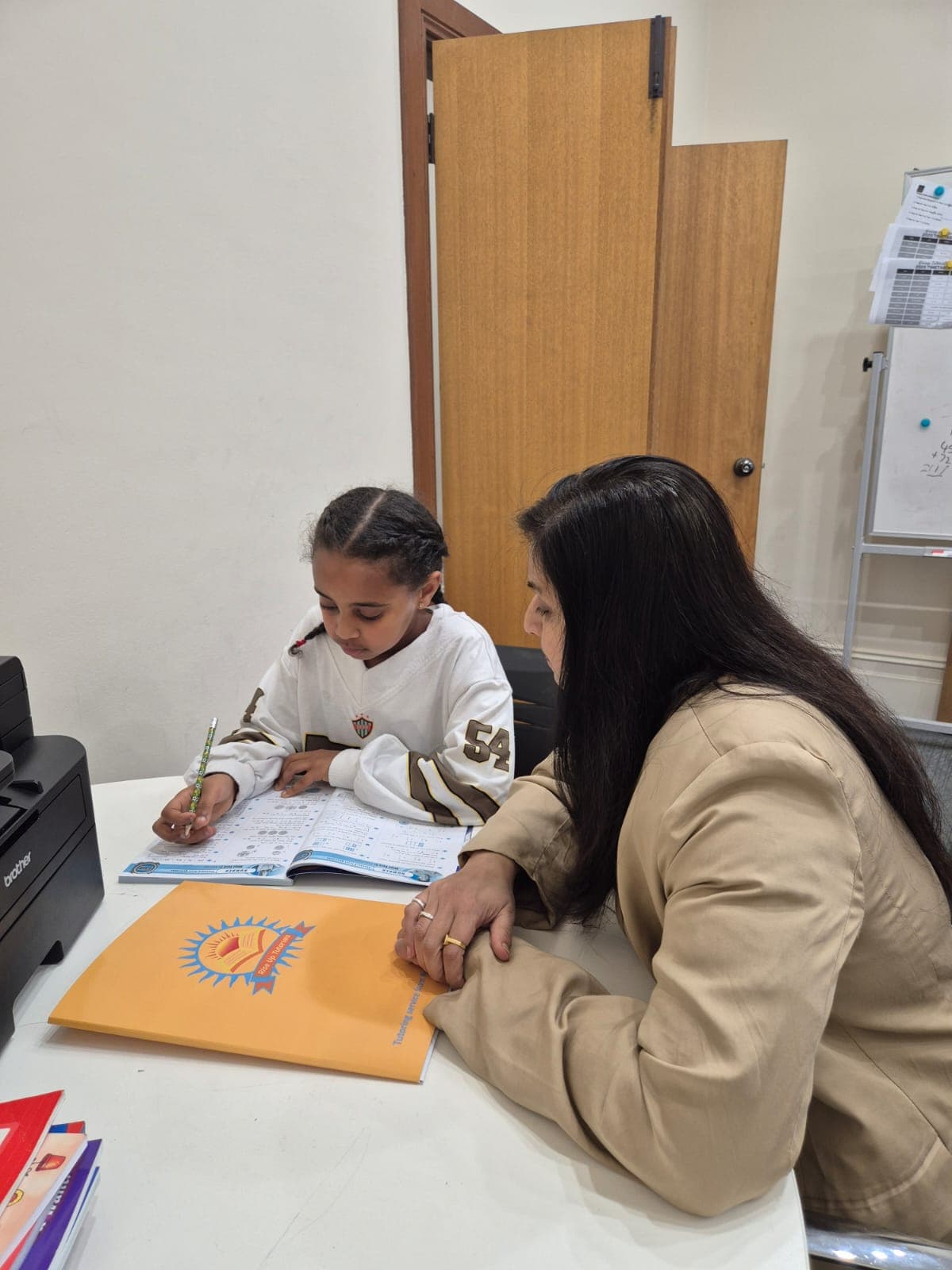 Young student working on worksheets